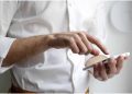 a man tapping on a phone